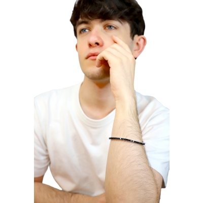 Pulsera tennis elástica en oro blanco 18k con diamantes negros