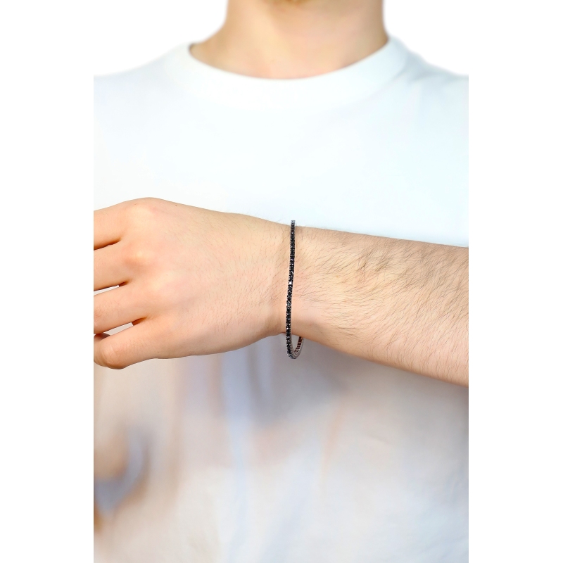 Pulsera tennis elastica en oro blanco de 18k con diamantes negros