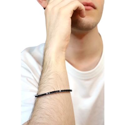 Pulsera tennis elástica en oro blanco 18k con diamantes negros