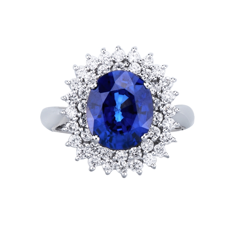 Anillo en oro blanco 18k con zafiro azul y doble halo de diamantes Anillo en oro blanco 18k con zafiro azul y doble halo de diamantes
