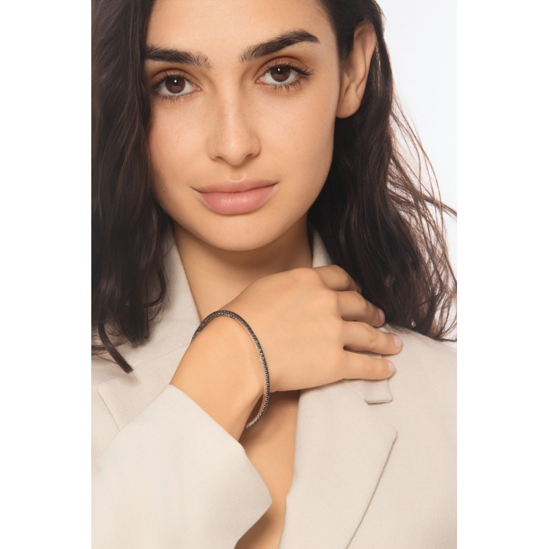 Pulsera tennis elastica en oro blanco de 18k con diamantes negros