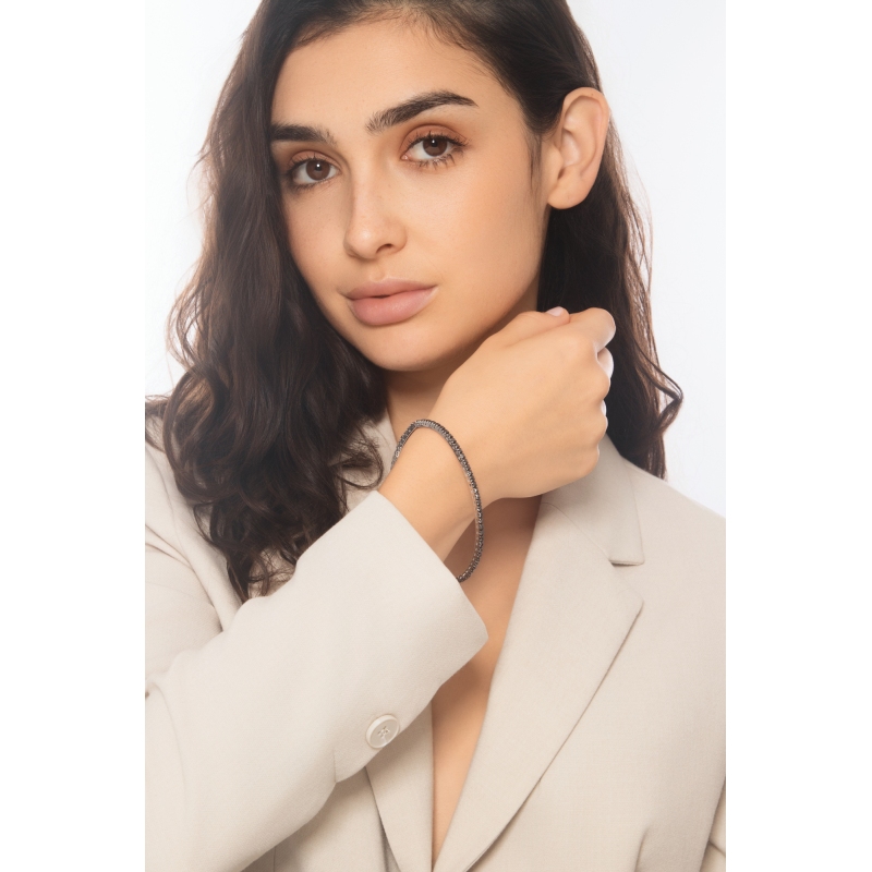 Pulsera tennis elastica con diamantes negros en oro blanco 750