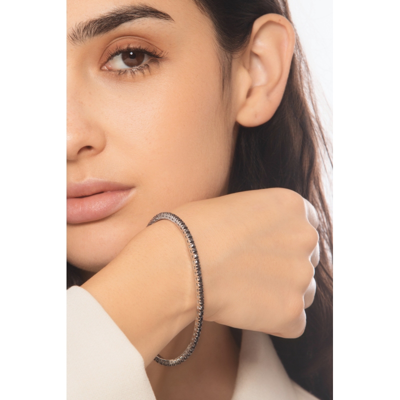 Pulsera tennis elastica con diamantes negros en oro blanco 750