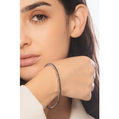 Pulsera tennis elastica con diamantes negros en oro blanco 750