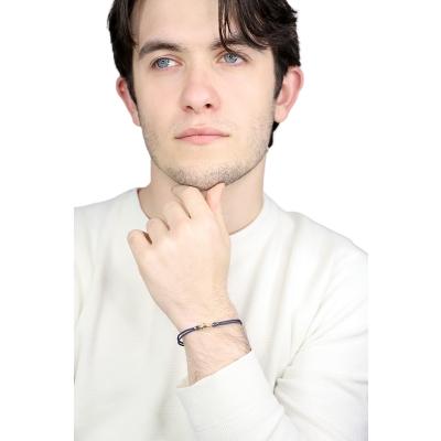 Pulsera cuerda azul con charm  ancla en oro amarillo 18k