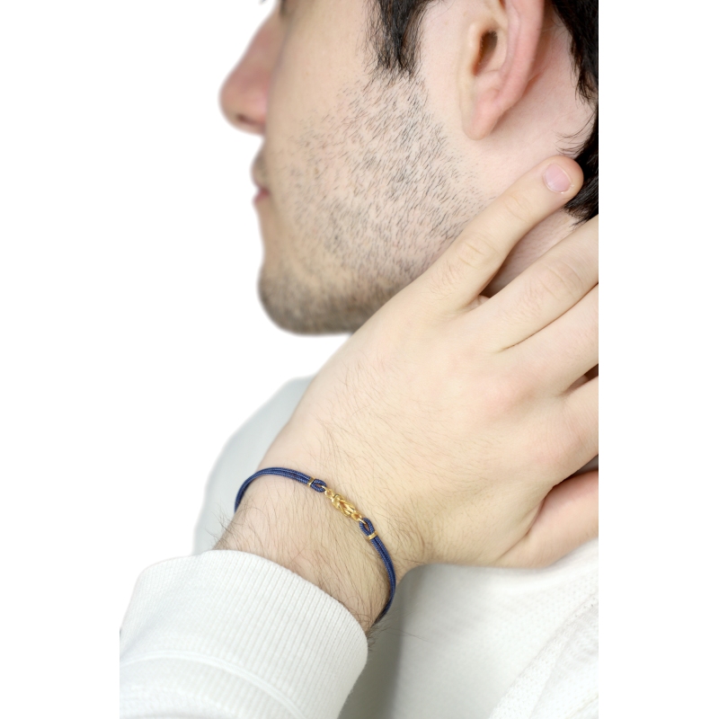 Pulsera de tela azul con nudo central en oro amarillo 18k Pulsera de tela azul con nudo central en oro amarillo 18k