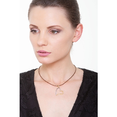 Colgante corazón en oro blanco y amarillo de 18K