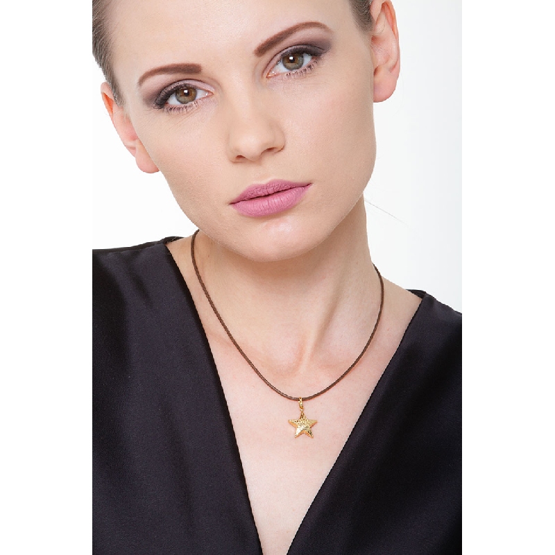 Colgante estrella en oro amarillo 18k